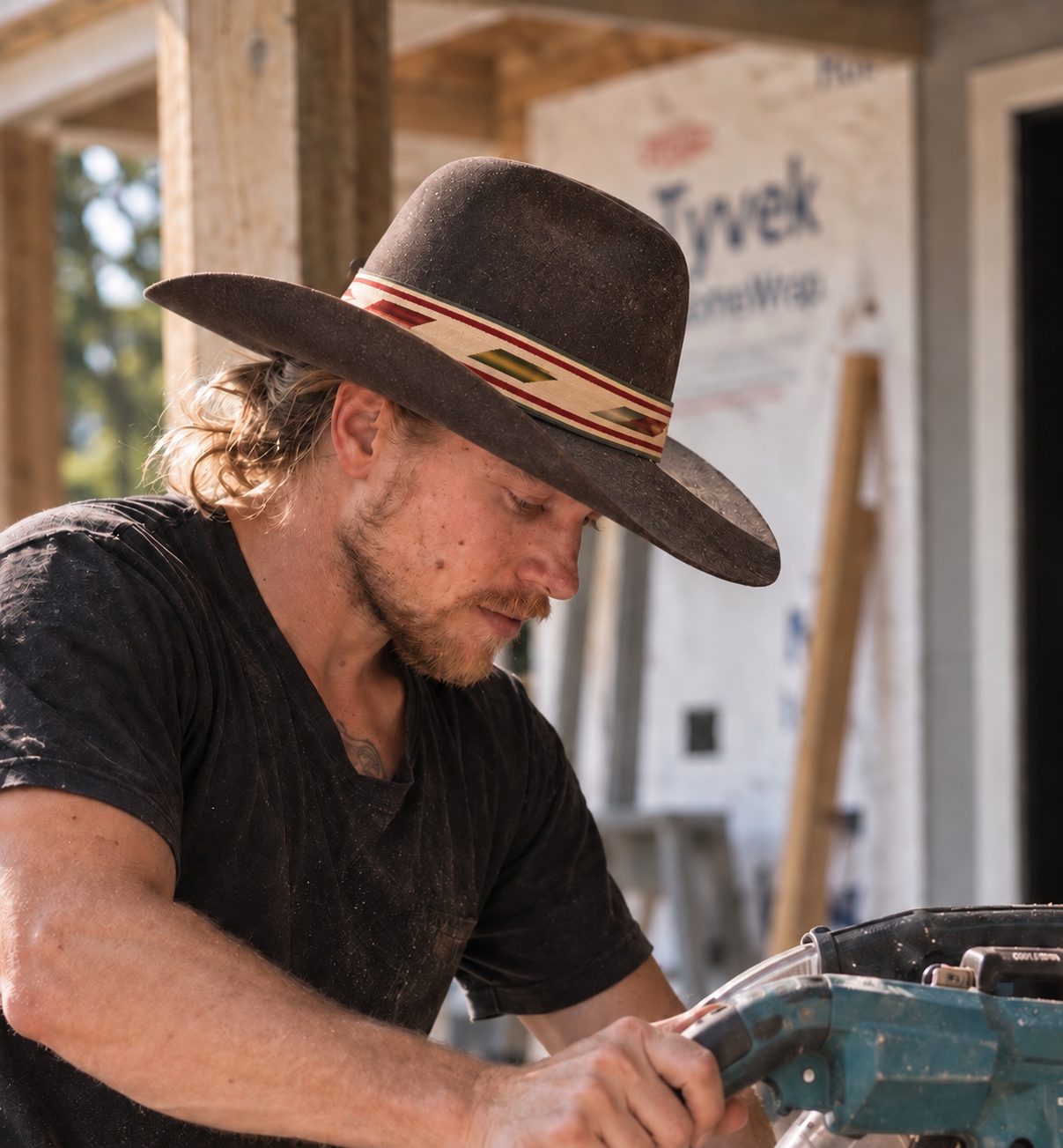 Gabriel working with a tool on a jobsite