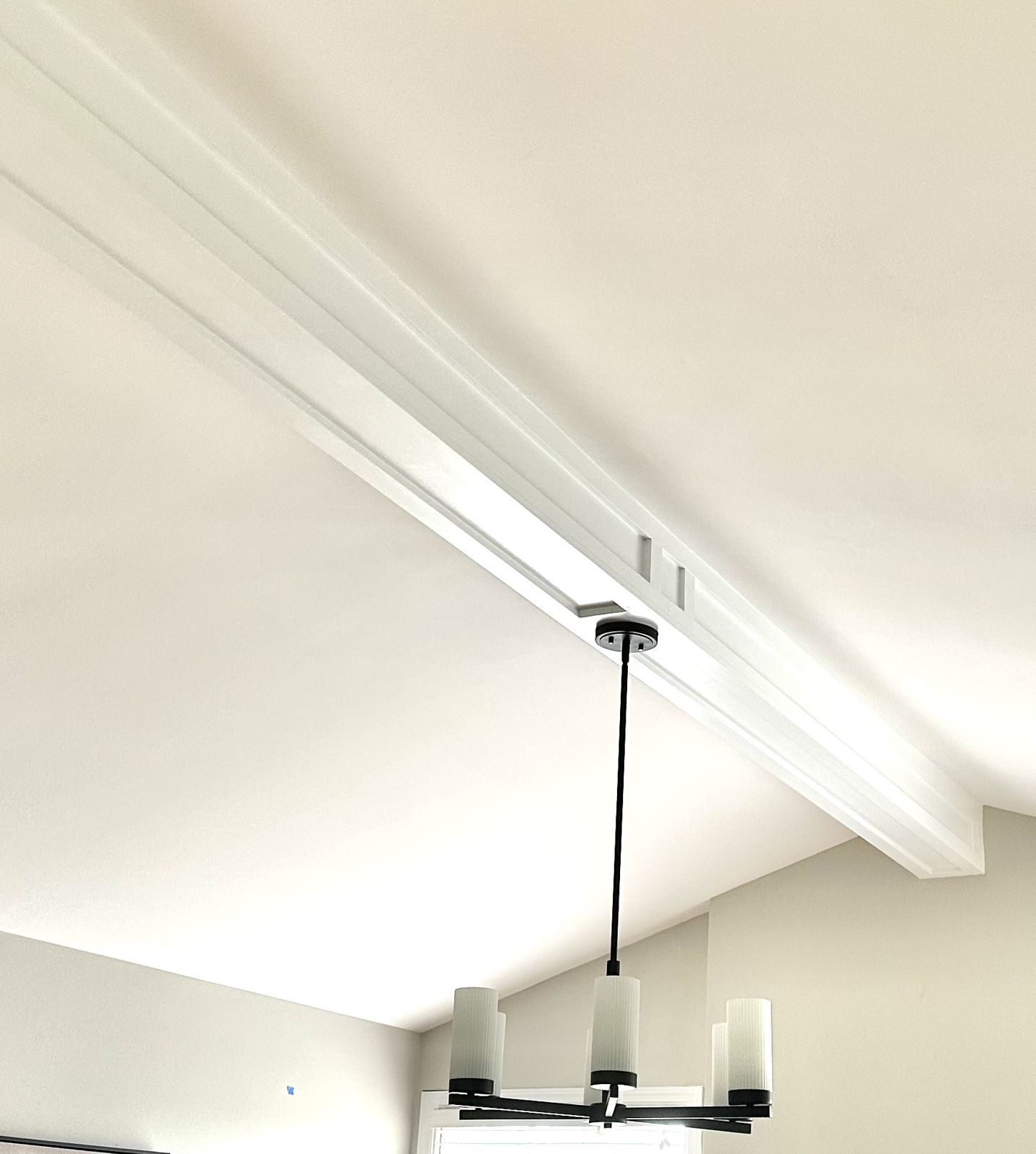 Custom ceiling beam with pendant light