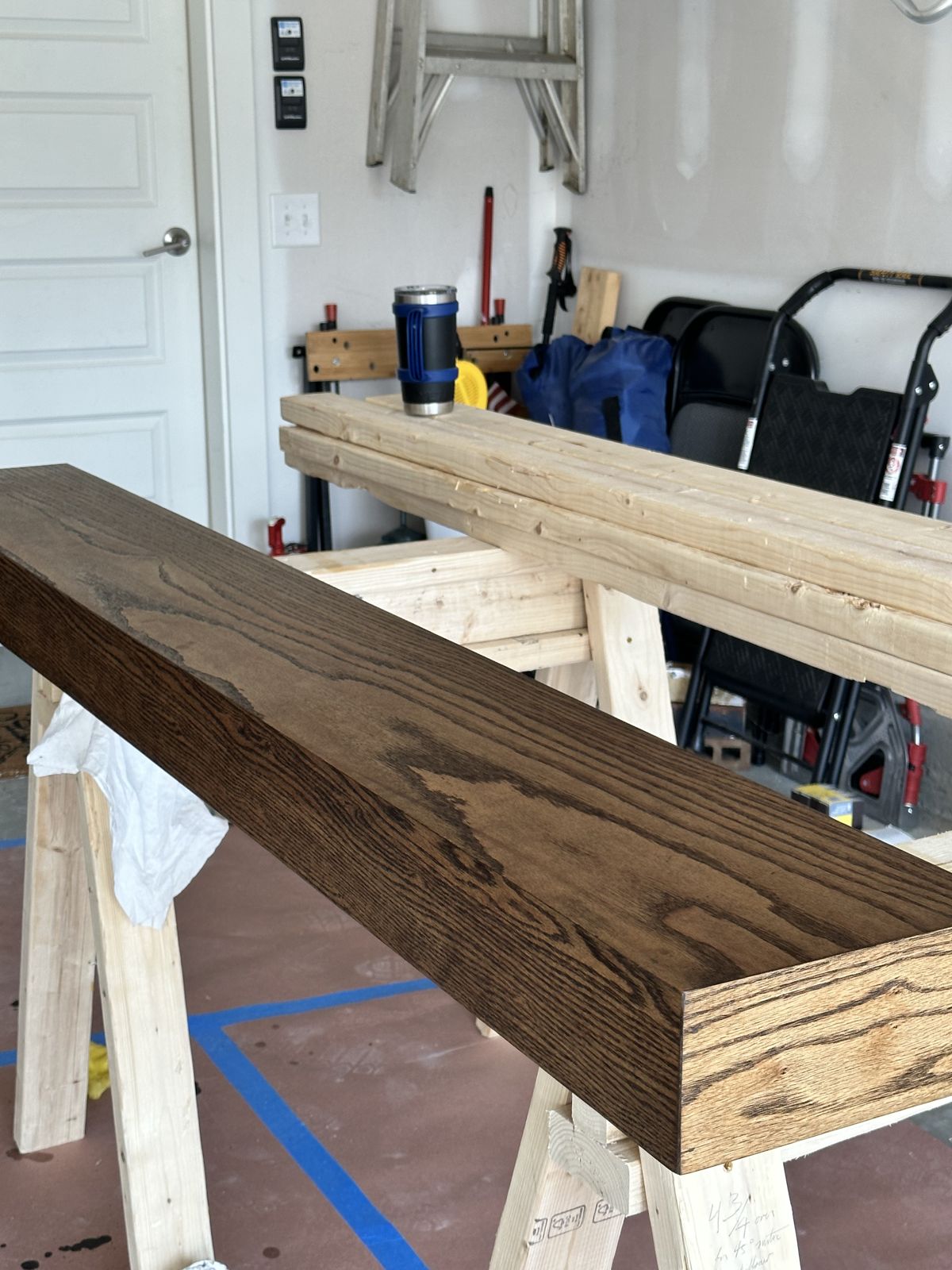 Custom mantel being stained in the shop