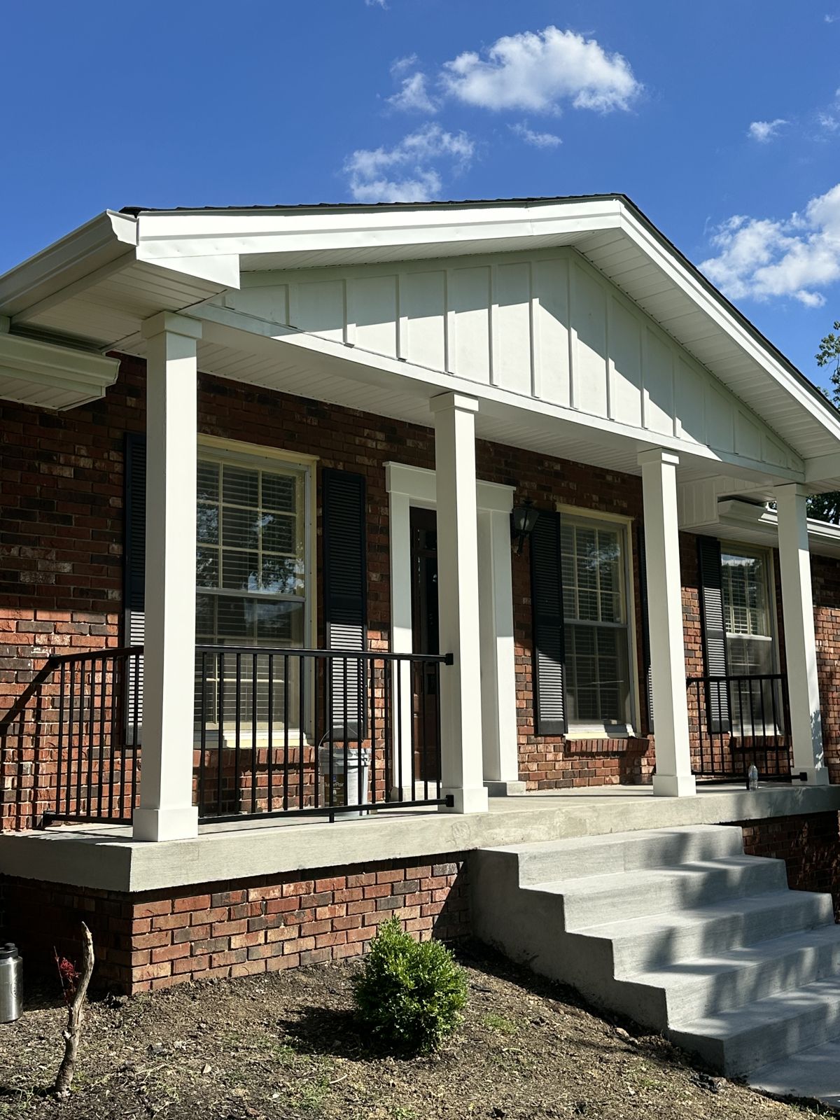 Finished brick and column porch with new railings