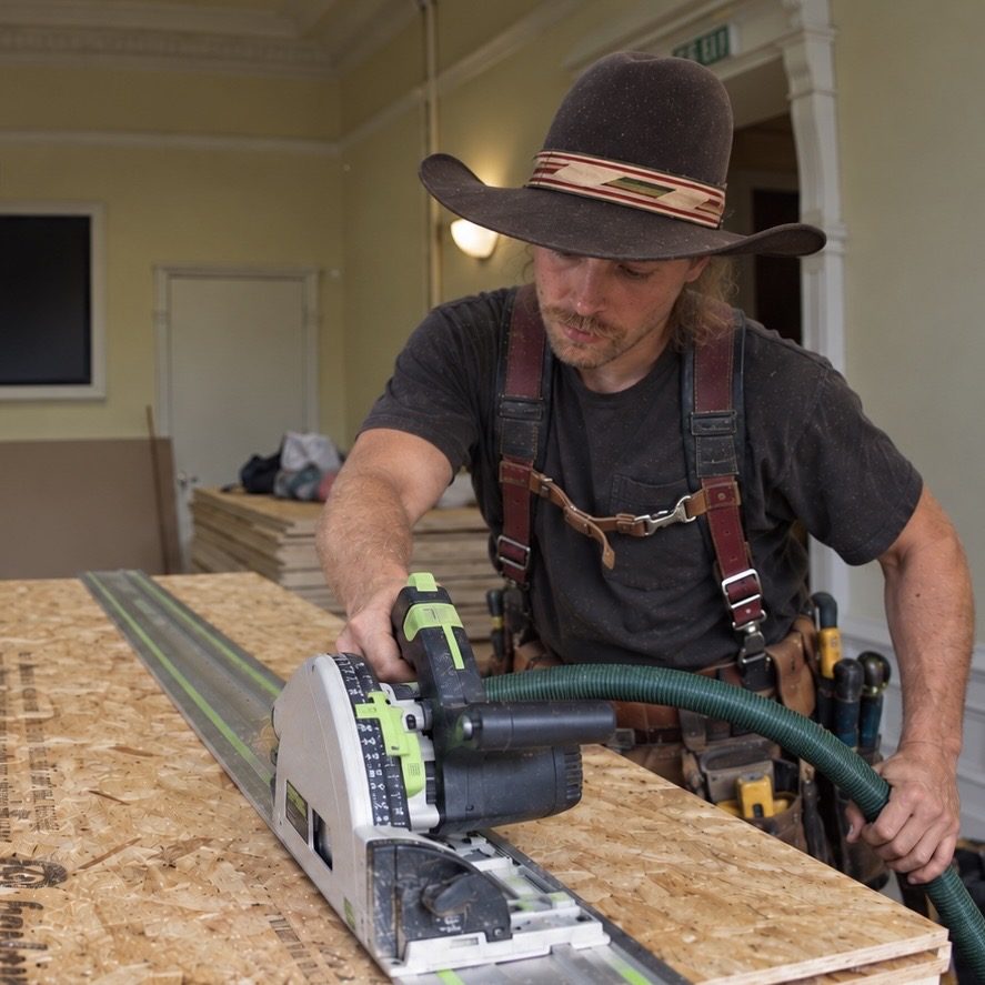 Gabriel making a cut with a track saw